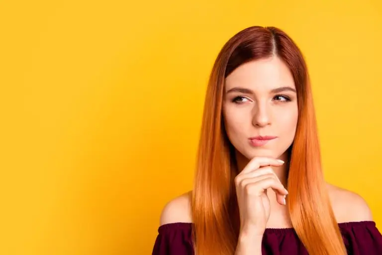 Woman thinking about whether an FHA home loan is right for her