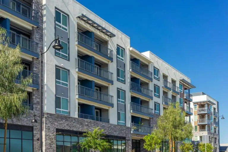 Modern apartment building with balconies under a clear blue sky