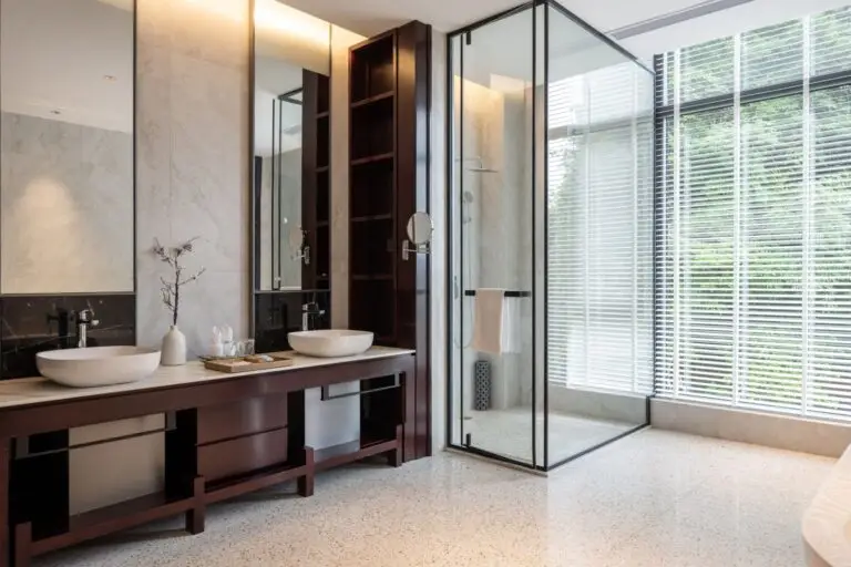 Modern bathroom with a double vanity and a glass walk in shower
