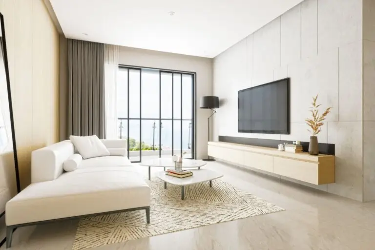 Bright living room with a white sofa and floor to ceiling windows