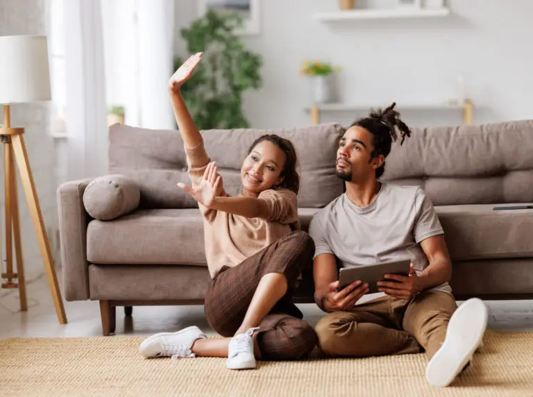 First time homebuyers holding the keys to their new home